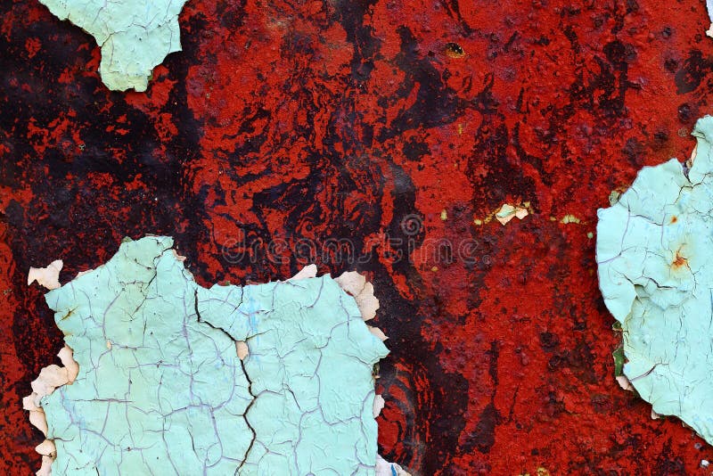 Old dried paint on rusty steel surface, red, blue stock photo